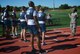 Explaining the fitness test parameters and answering questions, Senior Airman Hearon Octavia, far right, prepares to start the timing clock July 7, 2018, at Scott Air Force Base, Ill.  She is a member of the 932nd Airlift Wing's Services Flight and helps get Airmen ready for the various parts of the fitness test each unit training weekend.  (U.S. Air Force photo by Lt. Col. Stan Paregien)