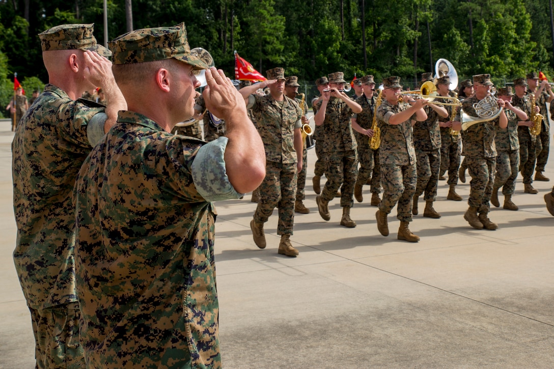 U.S. Marine Corps Lt. Col. Brian S. Albon and Lt. Col. Wyeth Towle, 2nd Intelligence Battalion, II Marine Expeditionary Force Information Group, salute during the pass and review at a change of command ceremony for 2nd Intelligence Battalion at Camp Lejeune, N.C., June 25, 2018. Albon relinquished command to Towle. (U.S. Marine Corps photo by Lance Cpl. Caleb T. Maher)