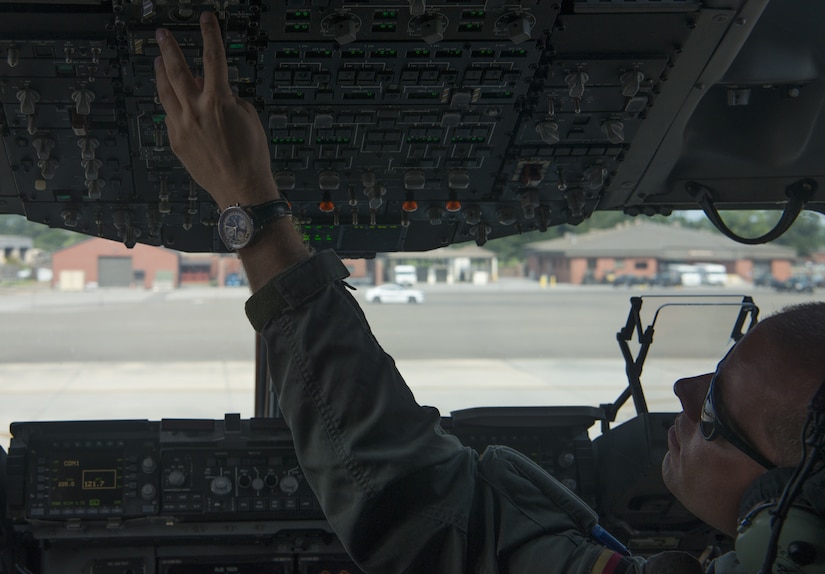 German air force Major Rico Persy, 14th Airlift Squadron German exchange pilot, performs preflight checks before the performance at the Great New England Air Show in Westover, Mass., July 14-15.