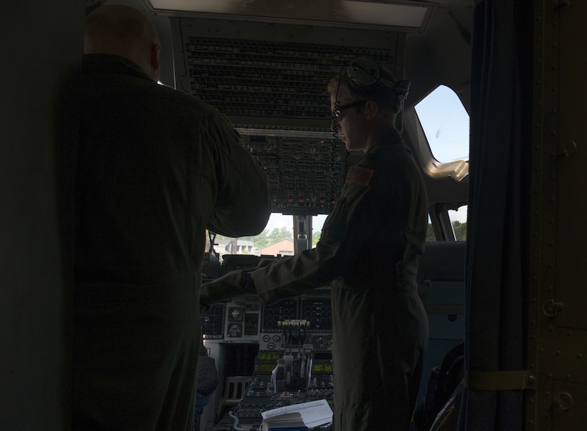 U.S. Air Force Capt. Brad Polender, 15th Airlift Squadron flight commander, right, and U.S. Air Force Lt. Col. J.D. Fariss, 437th Operations Group wing chief of standardization and evaluation, left, prepare for a performance during the Great New England Air Show in Westover, Mass.