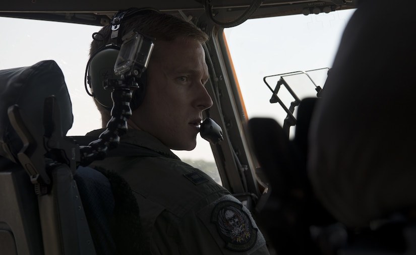 U.S. Air Force Capt. Brad Polender, 15th Airlift Squadron flight commander, communicates with his co-pilot while taxing out to the runway during the Great New England Air Show in Westover, Mass., July 14-15.