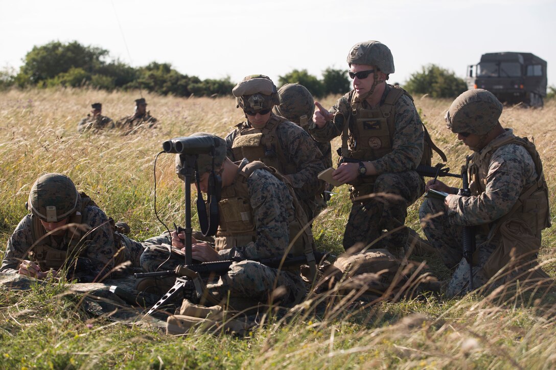 U.S. Marines with 2nd Air Naval Gunfire Liaison Company assist forward observer teams from the British Royal Army while conducting live-fire missions as part of Exercise Green Cannon 18 at Salisbury Plains, United Kingdom, July 4, 2018. Green Cannon is an annual live-fire exercise between the United States Marine Corps, allied and partner nations in order to increase interoperability in the region. (U.S. Marine Corps photo by Cpl. David Delgadillo)