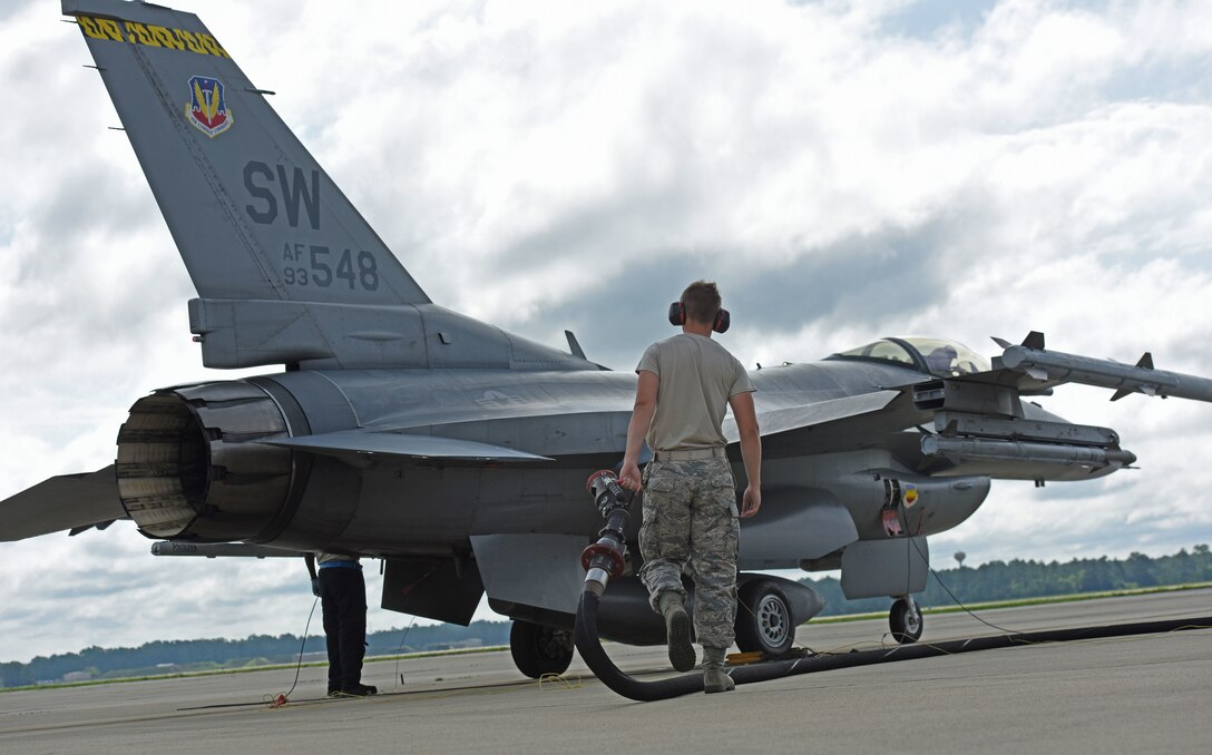 U.S. Air Force Senior Airman Ryan Cassidy, 20th Aircraft Maintenance Squadron (AMXS) tactical aircraft maintainer, sets up the refueling pump for his fellow Airmen at Shaw Air Force Base, S.C., June 26, 2018.