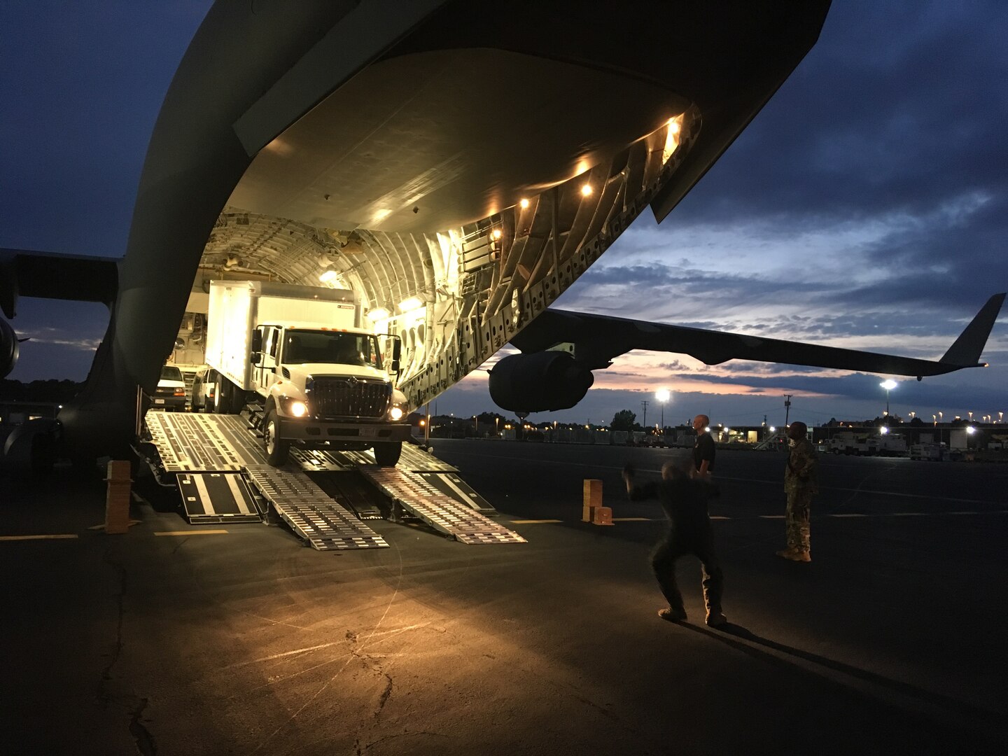 Members of Joint Task Force Civil Support (JTF-CS) and airmen from Langley Air Force Base load vehicles onto a Boeing C-17 Globemaster III during a no-notice Deployment Readiness Exercise (DRE). The purpose of the DRE was to test both commands ability to rapidly deploy during an incident. When directed, JTF-CS is ready to respond in 24 hours to provide command and control of 5,200 federal military forces located at more than 36 locations throughout the nation acting in support of civil authority response operations to save lives, prevent further injury, and provide critical support to enable community recover. (Official DoD photo by Air Force Lt. Col. Karen Roganov /released)