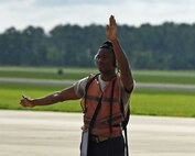 U.S. Air Force Staff Sgt. Jameson Holmes, 20th Aircraft Maintenance Squadron tactical aircraft maintainer, directs an F-16CM Fighting Falcon pilot at Shaw Air Force Base, S.C., June 26, 2018.
