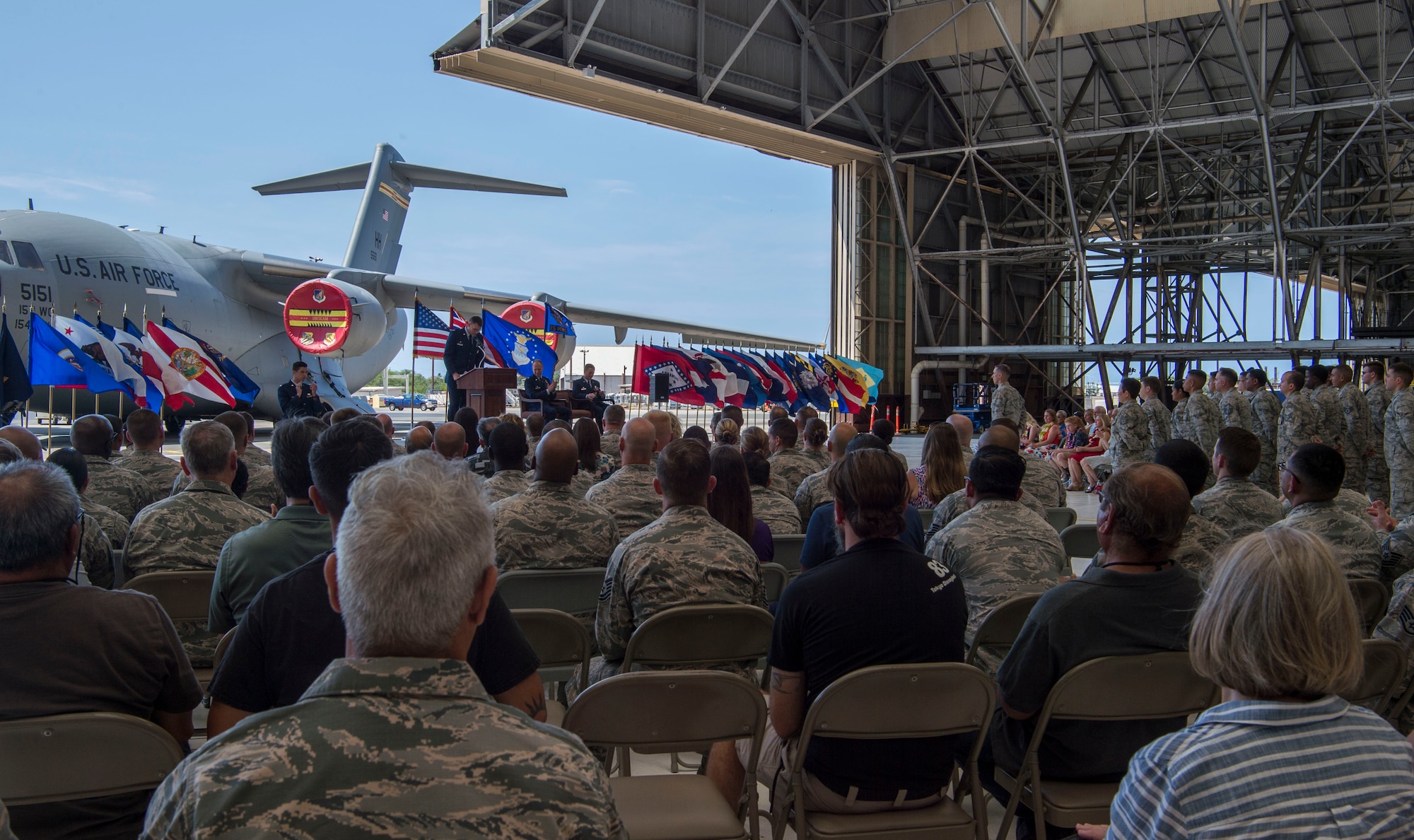 Airmen from around the 15th Wing, attend the 15th Maintenance Group change of command ceremony, Joint Base Pearl Harbor-Hickam, Hawaii, July 16, 2018. The MXG supports 31 home station aircraft to meet global airlift, global strike and theater security mission requirements and provides support to over 7,200 joint and allied aircraft transiting through Hickam Field each year. (U.S. Air Force photo by Tech. Sgt. Heather Redman)