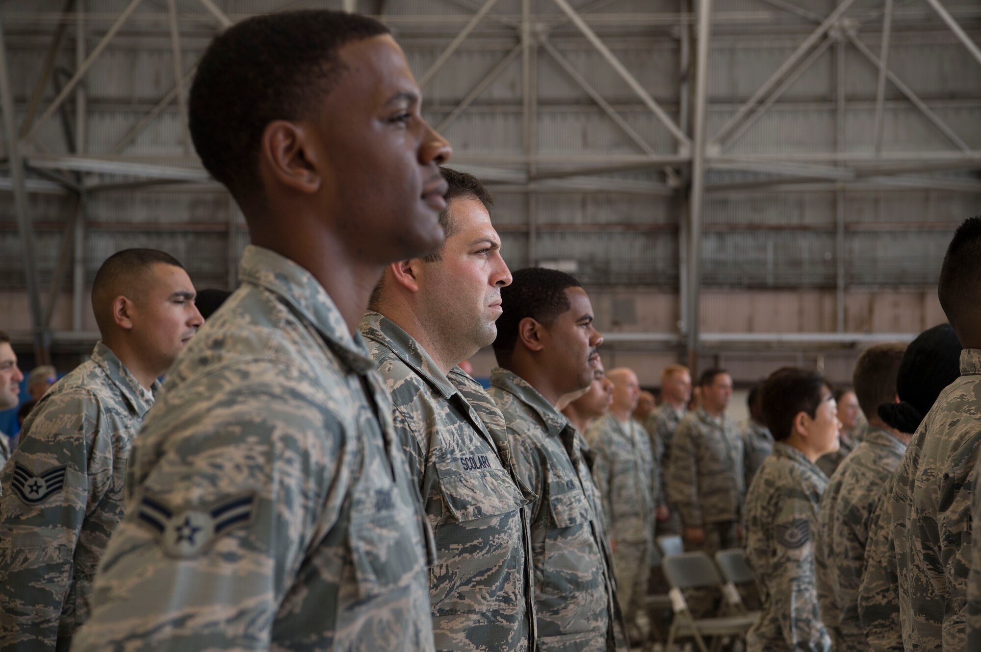 Airmen from the 15th Maintenance Group stand in formation during the MXG change of command ceremony, Joint Base Pearl Harbor-Hickam, Hawaii, July 16, 2018. The MXG supports 31 home station aircraft to meet global airlift, global strike and theater security mission requirements and provides support to over 7,200 joint and allied aircraft transiting through Hickam Field each year. (U.S. Air Force photo by Tech. Sgt. Heather Redman)