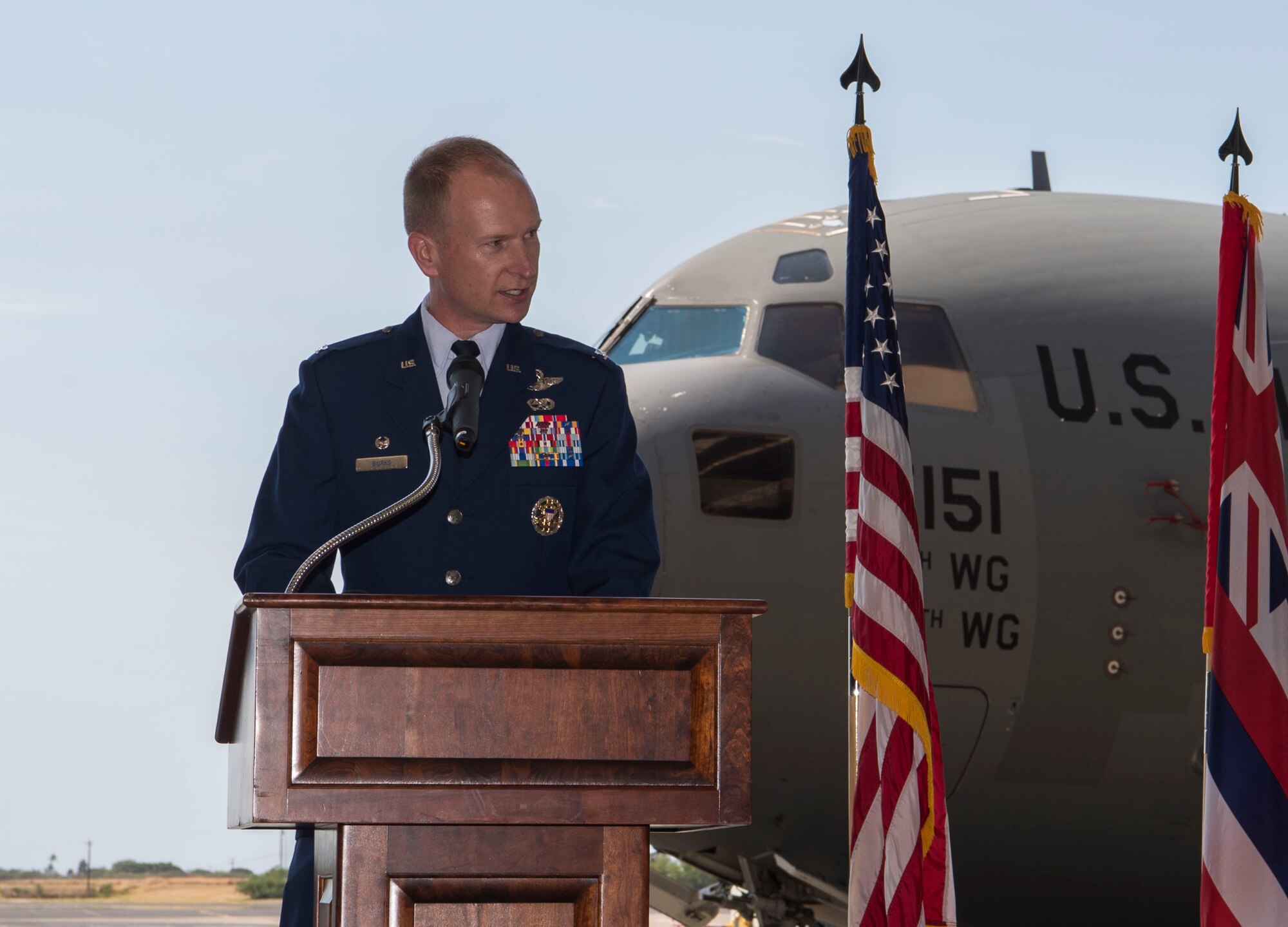 Col. Halsey Burks, 15th Wing commander, gives the opening comments during the 15th Maintenance Group change of command ceremony, Joint Base Pearl Harbor-Hickam, Hawaii, July 16, 2018. The MXG supports 31 home station aircraft to meet global airlift, global strike and theater security mission requirements and provides support to over 7,200 joint and allied aircraft transiting through Hickam Field each year. (U.S. Air Force photo by Tech. Sgt. Heather Redman)