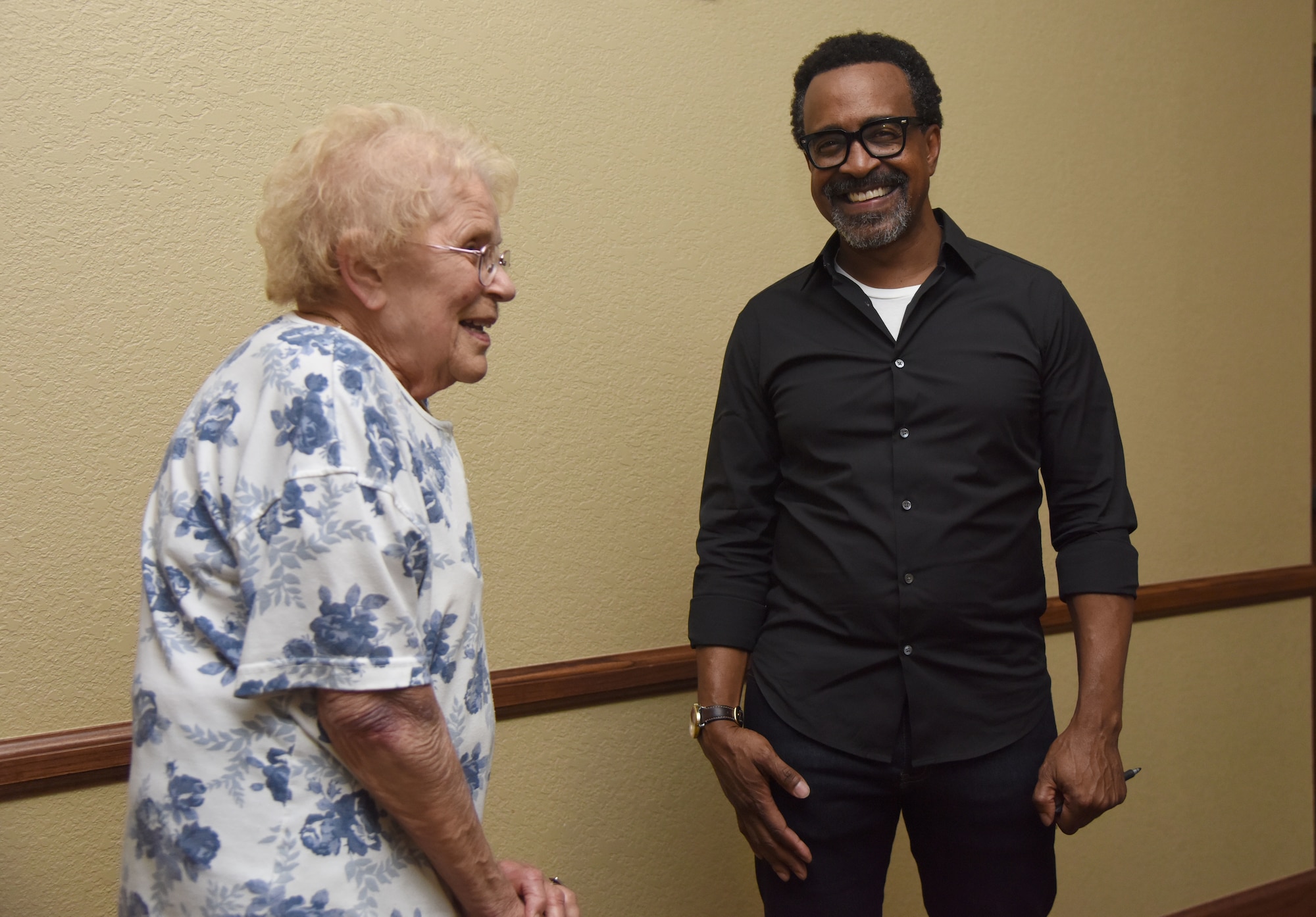 U.S. Air Force retired Col. Phyllis Luttman meets Tim Meadows, actor and comedian, following his performance at the Bay Breeze Event Center at Keesler Air Force Base, Mississippi, July 14, 2018. Meadows is also an alumni of the late-night comedy show, Saturday Night Live. (U.S. Air Force photo by Kemberly Groue)