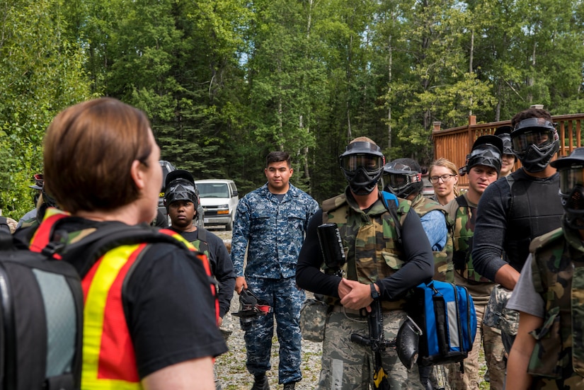 Tactical Combat Casualty Care instructors and 673d Medical Group personnel prepare to begin the practical application of the TCCC course at the Warrior Extreme Paintball course at Joint Base Elmendorf-Richardson, Alaska, July 13, 2018. The course is an opportunity for every student to provide care under fire, perform tactical field care on those who are injured and execute a tactical evacuation.