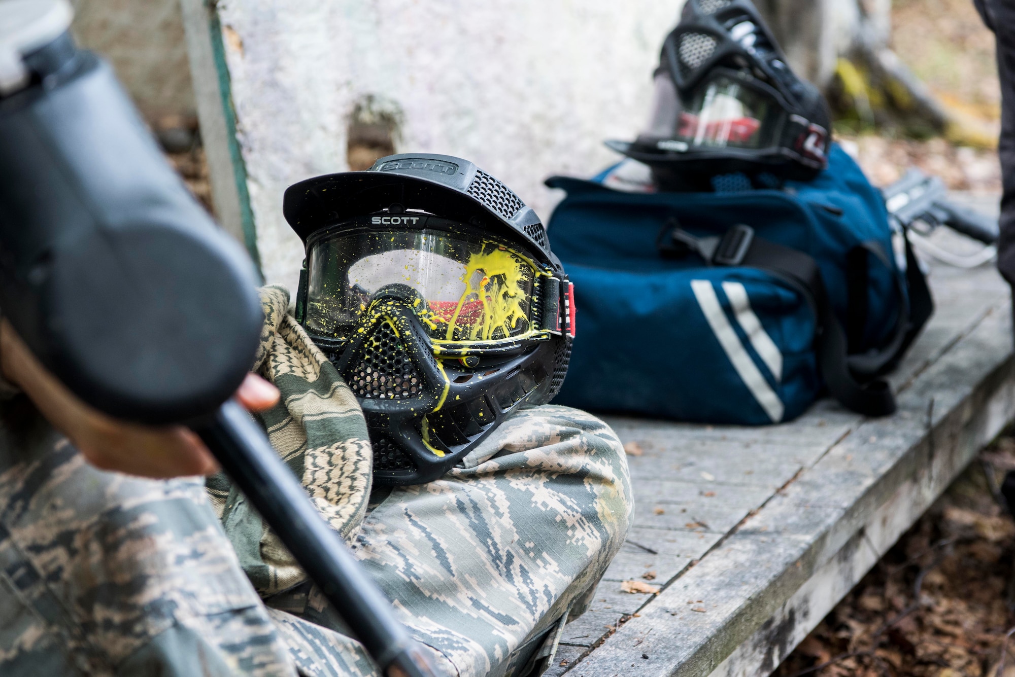 A Tactical Combat Casualty Care instructor waits for 673d Medical Group personnel to prepare for the practical application of the TCCC course at the Warrior Extreme Paintball course at Joint Base Elmendorf-Richardson, Alaska, July 13, 2018. The course is an opportunity for every student to provide care under fire, perform tactical field care on those who are injured and execute a tactical evacuation.