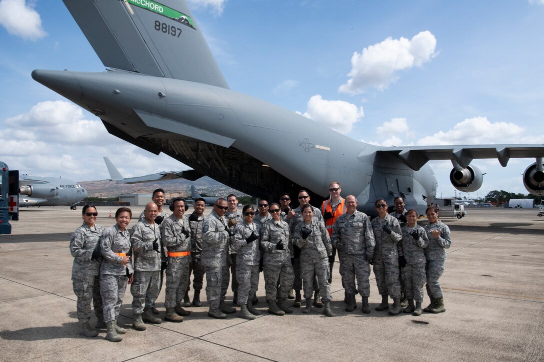 U.S. Air Force Reserve members from the 624th Aeromedical Staging Squadron participate during Pacific Lifeline 2018 at U.S. Coast Guard Air Station Barbers Point, Hawaii, July 10, 2018. Pacific Lifeline 2018 is a statewide medical exercise in Hawaii conducted as part of a larger 2018 Rim of the Pacific Exercise.