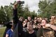 The Pacific Air Forces’ F-16 Demonstration Team and Alaskan locals, take a selfie with Eddie P., the Anchorage Morning Show host, in Anchorage, Alaska, June 29, 2018. The team engaged with the community by participating in park beautification, conducting a meet-and-greet and attending a formlal dinner with the Anchorage, Alaska, city leaders. This afforded the team an opportunity to meet with their supporters and build trust and patriotism within the Alaskan community. (U.S. Air Force photo by Senior Airman Sadie Colbert)