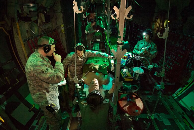 Flight Nurse and Aeromedical Technician Course students care for a simulated patient during a simulated aeromedical evacuation mission aboard a C-130H mockup at the 711th Human Performance Wing’s U.S. Air Force School of Aerospace Medicine at Wright-Patterson Air Force Base, Ohio, Jan. 29, 2018. (U.S. Air Force photo by J.M. Eddins Jr.)