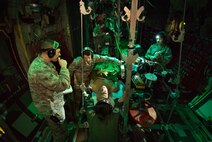 Flight Nurse and Aeromedical Technician Course students care for a simulated patient during a simulated aeromedical evacuation mission aboard a C-130H mockup at the 711th Human Performance Wing’s U.S. Air Force School of Aerospace Medicine at Wright-Patterson Air Force Base, Ohio, Jan. 29, 2018. (U.S. Air Force photo by J.M. Eddins Jr.)