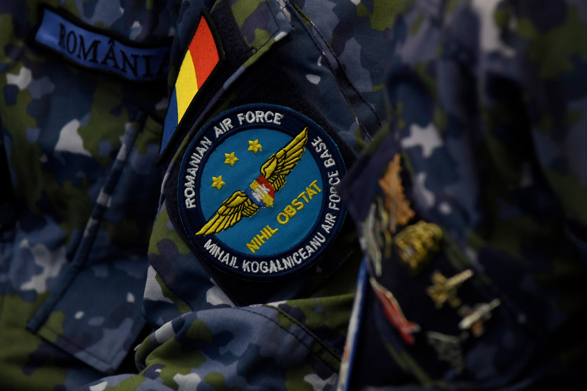 A Romanian air force member listens during the Romanian air force’s International Senior Enlisted Leader Visit at Mihail Kohalniceanu Air Force Base, Romania, July 11, 2018.