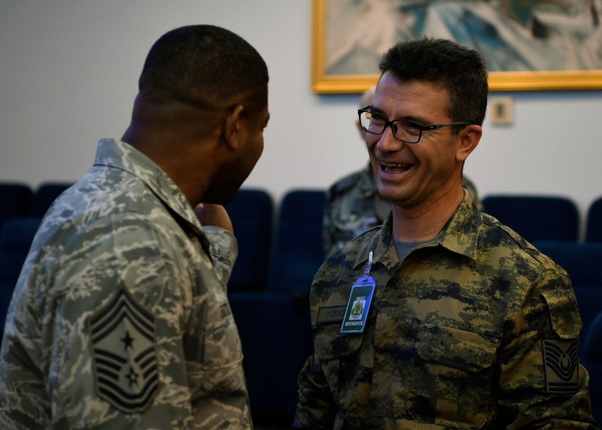 Chief Master Sgt. of the Turkish air force Ibrahim Türker and U.S. Air Force Chief Master Sgt. Phillip L. Easton, United States Air Forces in Europe and Africa command chief, talk during the Romanian air force’s International Senior Enlisted Leader Visit at Bucharest, Romania, July 10, 2018