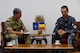 Royal Air Force Chief Warrant Officer Jake Alpert, Allied Air Command command senior enlisted leader, and Plutonier Adjutant Principal Daniel Sîmpetru, Chief Master Sgt. of the Romanian air force, talk during the Romanian air force’s International SEL Visit at Mihail Kohalniceanu Air Force Base, Romania, July 11, 2018.