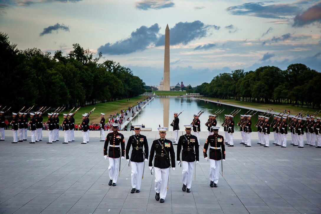 Marines with Marine Barracks Washington D.C., march in formation during the sunset parade at the Lincoln Memorial in Washington D.C. July 17, 2018. The sunset parade pays tribute to those whose uncommon valor was a common virtue.