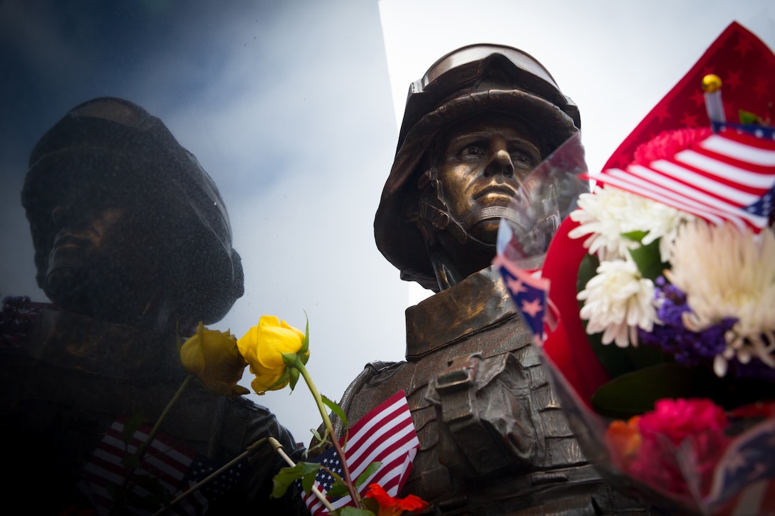 A statue of a U.S. Marine stands during the annual Field of Honor memorial ceremony at Castaways Park, Newport Beach, Calif., May 28, 2018. The memorial was dedicated on May 26th, 2008 to honor all military personnel who have served in the United States military.