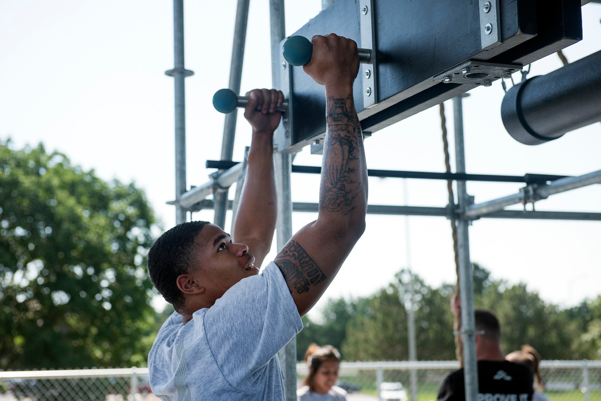 .S. Air Force Physical Training Leaders participate in an Alpha Warrior Battle Rig training course July 10-11, 2018, at Whiteman Air Force Base, Missouri. The PTLs from Scott AFB in Illinois and McConnell AFB in Kansas joined PTLs from Whiteman AFB in a two-day course to become certified on the equipment in order to integrate the battle rig into unit physical training sessions. Units at Whiteman can use the Alpha Warrior Battle Rig during group workouts with a certified member present. The Whiteman Fitness Center will be starting Alpha Warrior Battle Rig classes in August 2018 for Airmen . For more information, contact the Fitness Center at 660-687-5496. (U.S. Air Force photo by Airman 1st Class Taylor Phifer)