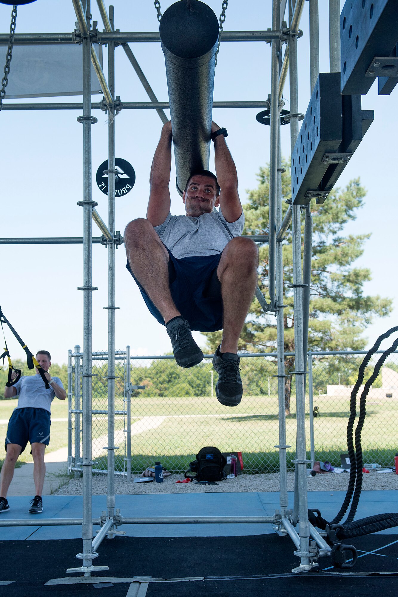 .S. Air Force Physical Training Leaders participate in an Alpha Warrior Battle Rig training course July 10-11, 2018, at Whiteman Air Force Base, Missouri. The PTLs from Scott AFB in Illinois and McConnell AFB in Kansas joined PTLs from Whiteman AFB in a two-day course to become certified on the equipment in order to integrate the battle rig into unit physical training sessions. Units at Whiteman can use the Alpha Warrior Battle Rig during group workouts with a certified member present. The Whiteman Fitness Center will be starting Alpha Warrior Battle Rig classes in August 2018 for Airmen . For more information, contact the Fitness Center at 660-687-5496. (U.S. Air Force photo by Airman 1st Class Taylor Phifer)