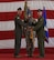 Col. Brian Laidlaw accepts the wing guidon from Maj. Gen. Scott J. Zobrist during the wing change of command ceremony.
