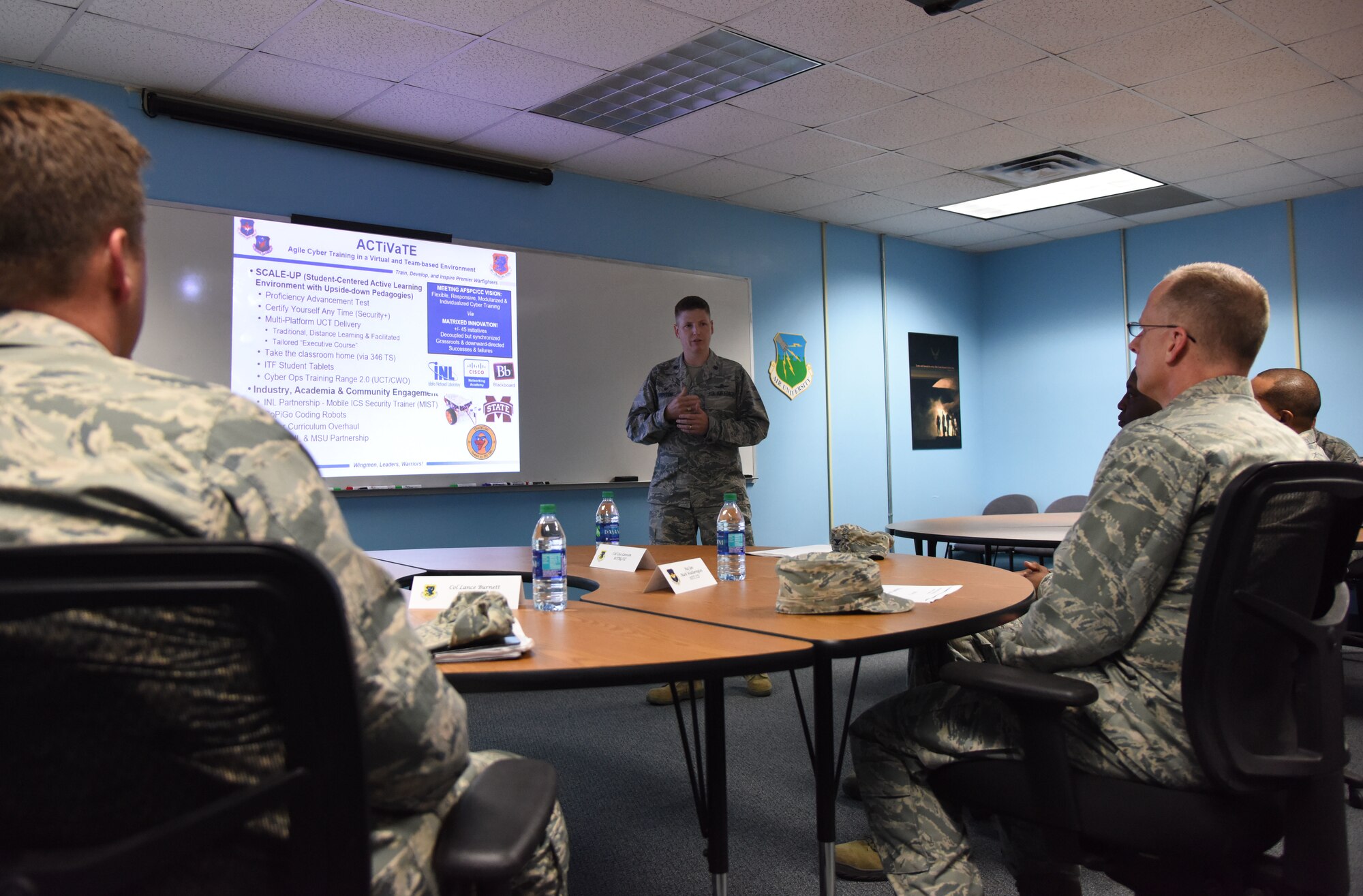 U.S. Air Force Lt. Col. Nathaniel Huston, 333rd Training Squadron commander, explains how 81st Training Group squadrons are implementing Continuum of Learning strategies into the classrooms to Maj. Gen. Mark Weatherington, Air Education and Training Command deputy commander, during a site visit at Bryan Hall on Keesler Air Force Base, Mississippi, July 11, 2018. Weatherington had a one-day site visit at Keesler to become more familiar with the base’s mission. He also received 81st Training Wing and 81st TRG mission briefings followed by a windshield tour of the base. (U.S. Air Force photo by Kemberly Groue)