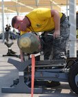 Staff Sgt. Dawson Bailey, 61st Aircraft Maintenance Unit load crew member prepares a bomb for movement during the 56th Maintenance Group 2nd Quarter Load Competition, July 13, 2018 at Luke Air Force Base, Ariz.