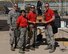 Col. Scott Briese, 944th Maintenance Group commander, presents the load crew of the quarter trophy to members from the 63rd Aircraft Maintenance Unit, July 13, 2018 at Luke Air Force Base, Ariz.