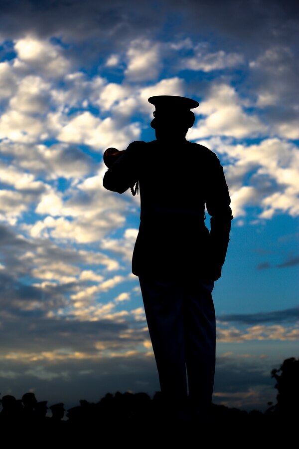 Staff Sgt. Codie Williams, ceremonial bugler, “The Commandant’s Own,” U.S. Marine Drum & Bugle Corps, plays Taps during a Tuesday Sunset Parade at the Lincoln Memorial, Washington D.C., July 17, 2018. The guest of honor for the parade was Thom R. Tillis, North Carolina U.S. Senator, and the hosting official was Lt. Gen. Michael A. Rocco, deputy commandant, Manpower and Reserve Affairs. (Official U.S. Marine Corps photo by Lance Cpl. James Bourgeois/Released)