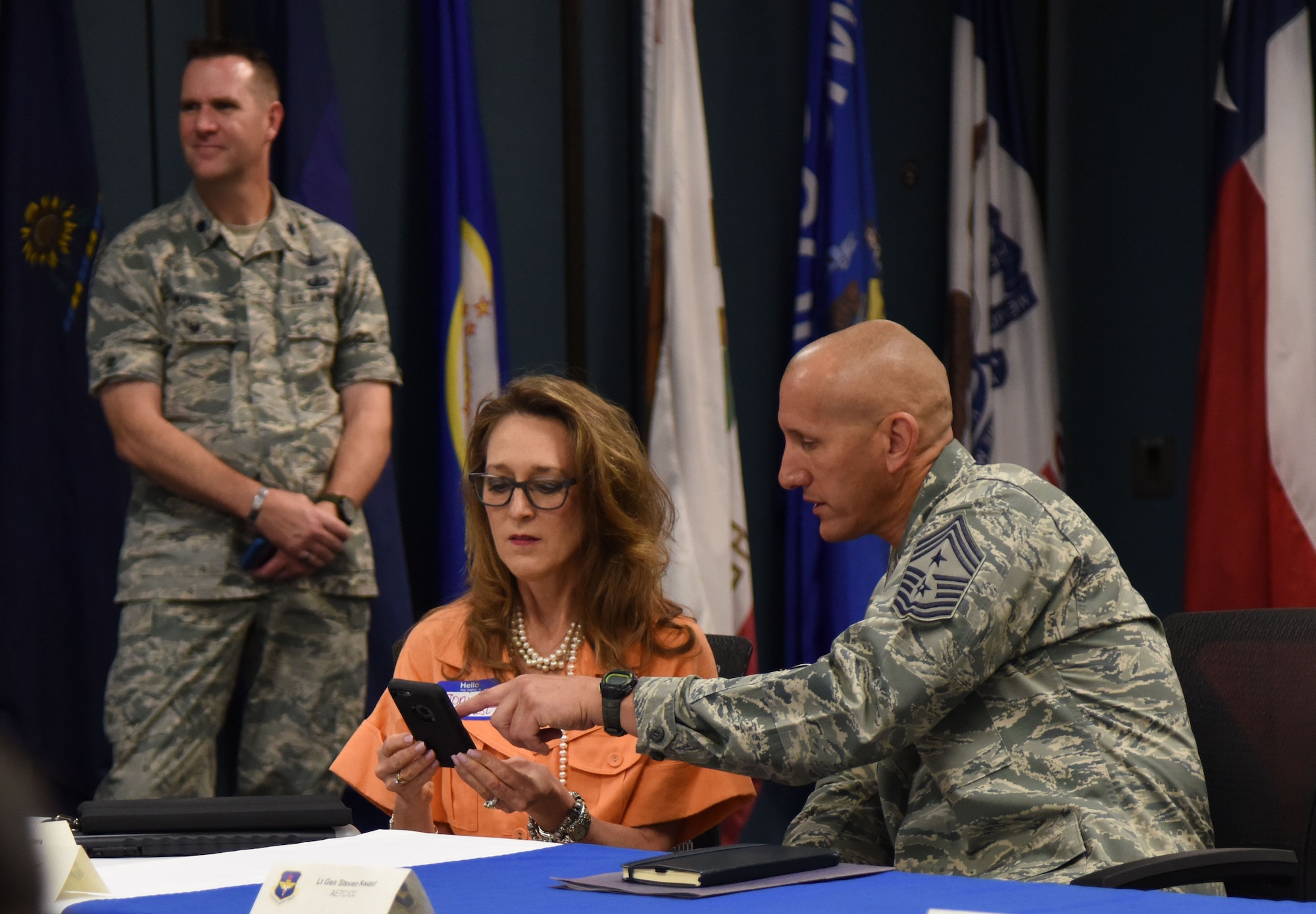 U.S. Air Force Chief Master Sgt. Kenneth Carter, 81st Training Wing command chief, shows Joni Kwast, spouse of Lt. Gen. Steven Kwast, Air Education and Training Command commander, the Keesler app during a tour at the Levitow Training Support Facility on Keesler Air Force Base, Mississippi, July 16, 2018. The Kwasts received an 81st Training Group briefing followed by a tour of the Keesler Medical Center to become more familiar with Keesler’s mission. (U.S. Air Force photo by Kemberly Groue)