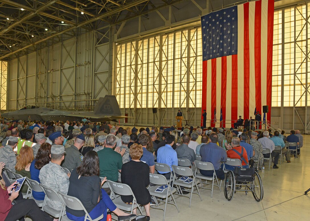 Brig. Gen. E. John Teichert III, gives his first salute to his workforce after assuming command of the 412th Test Wing July 18 in Hangar 1600 at Edwards Air Force Base. (U.S. Air Force photo by Kenji Thuloweit)