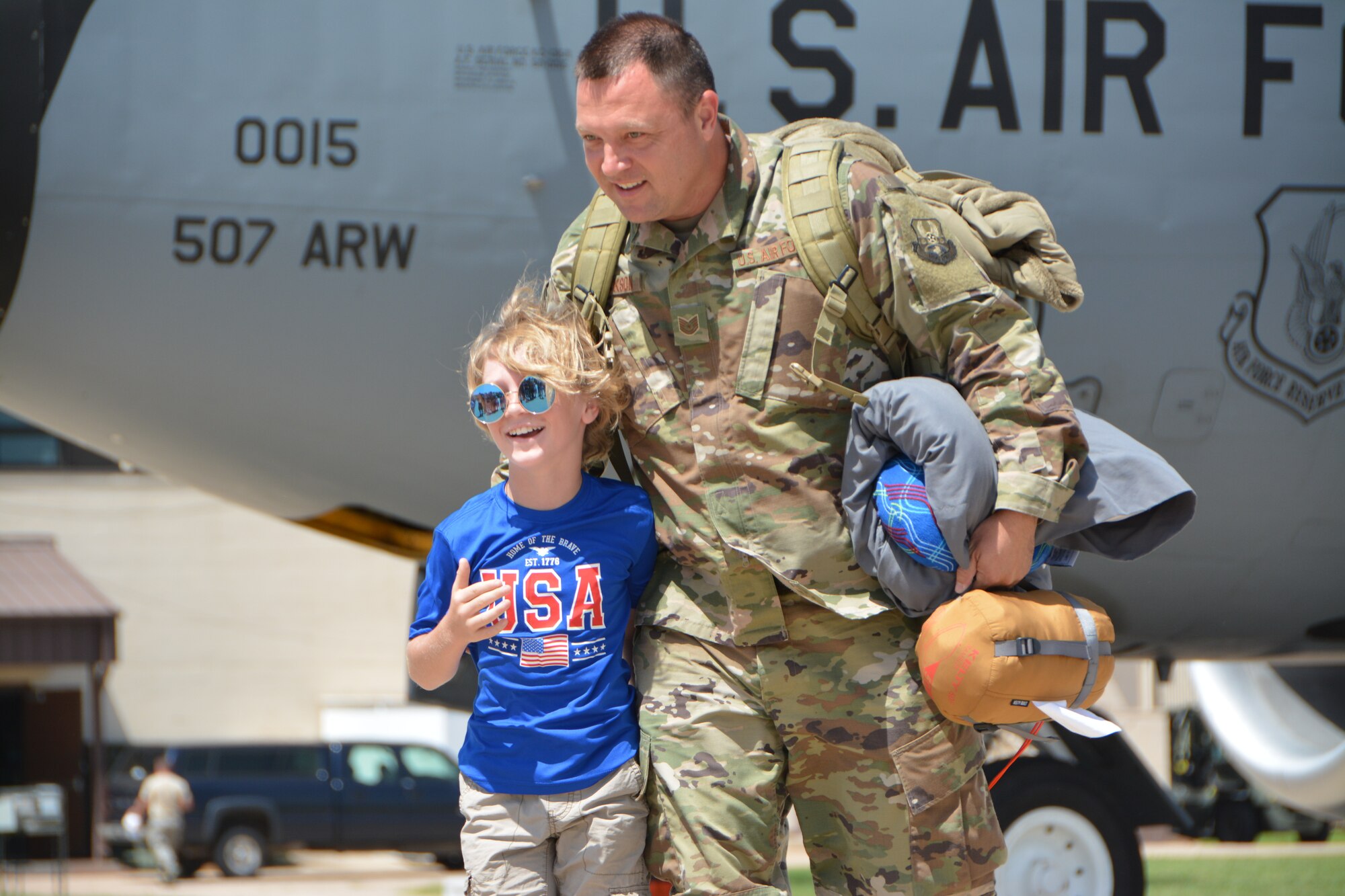 U.S. Air Force Tech. Sgt. Brian Jackson with the 507th Operations Support Squadron at Tinker Air Force Base, Okla., reunites with his son following a deployment July 3, 2018. More than 100 Reserve Citizen Airmen from the 507th Air Refueling Wing at Tinker AFB deployed to Incirlik Air Base, Turkey, in support of air operations. (U.S. Air Force photo by Tech. Sgt. Samantha Mathison)