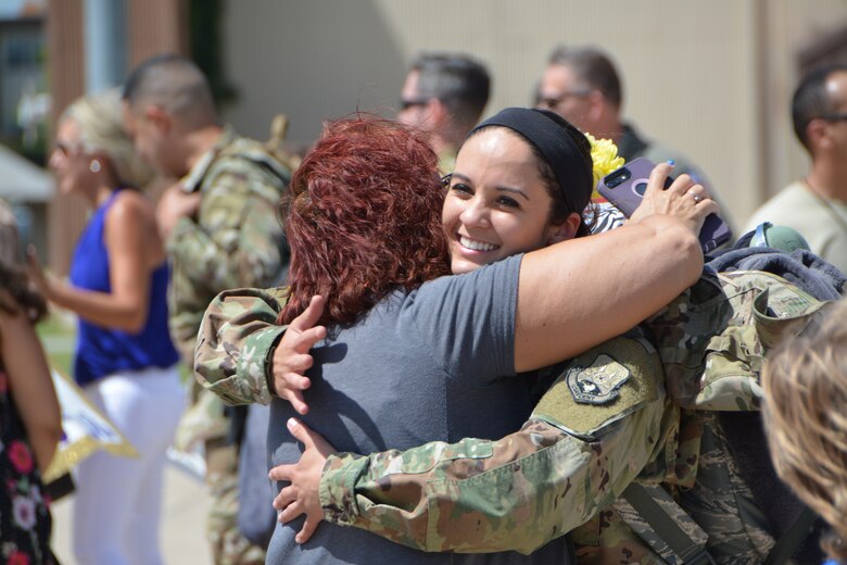 Staff Sgt. Nathalie Hamilton, a KC-135R Stratotanker aircraft crew chief with the 507th Aircraft Maintenance Squadron at Tinker Air Force Base, Okla., reunites with her mother following a deployment July 3, 2018. More than 100 Reserve Citizen Airmen from the 507th Air Refueling Wing at Tinker AFB deployed to Incirlik Air Base, Turkey, in support of air operations. (U.S. Air Force photo by Tech. Sgt. Samantha Mathison)