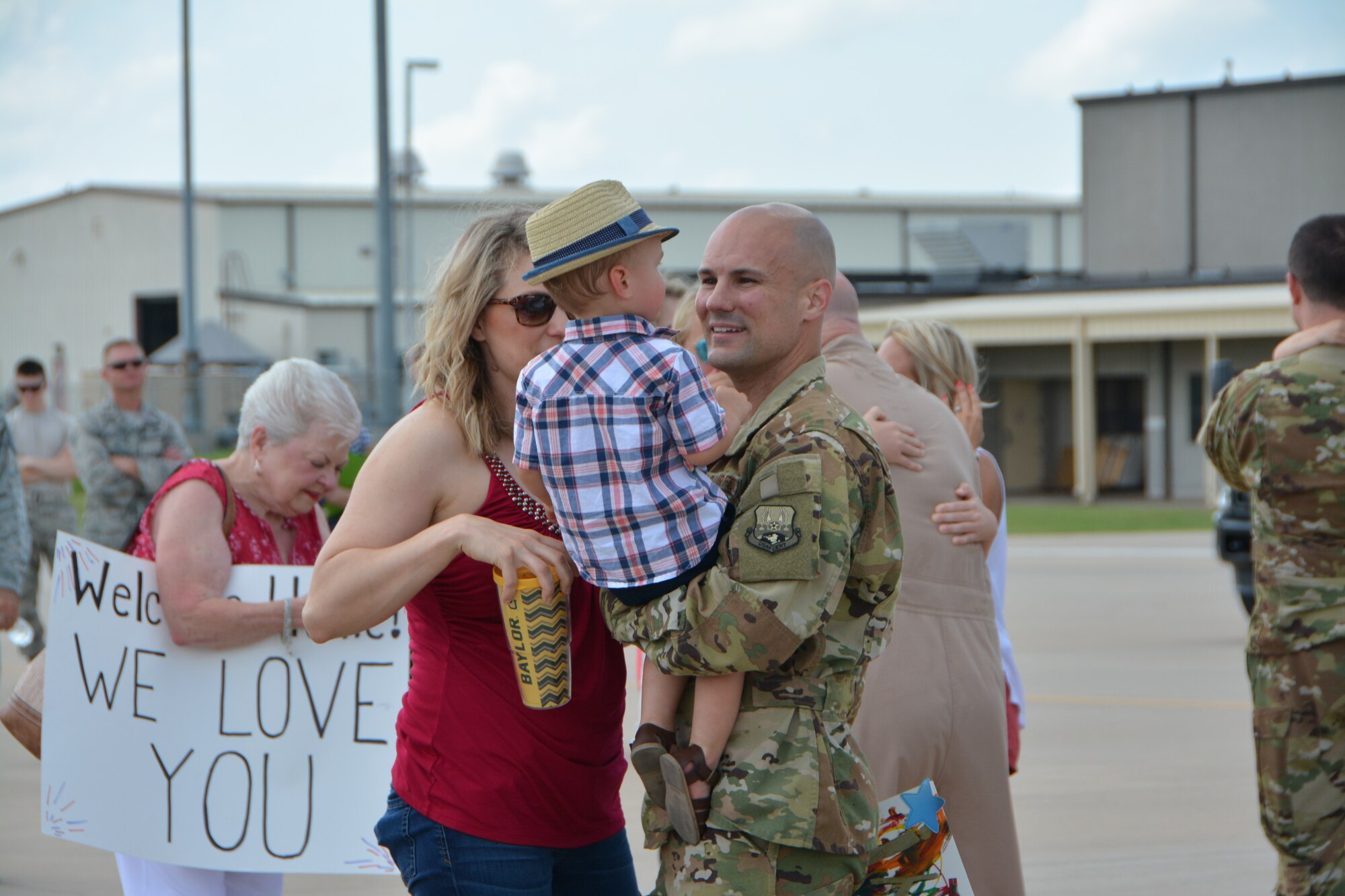 U.S. Air Force Master Sgt. Sean Gilson, a KC-135R Stratotanker aircraft in-flight refueling technician with the 465th Air Refueling Squadron at Tinker Air Force Base, Okla., reunites with his family following a deployment July 5, 2018. More than 100 Reserve Citizen Airmen from the 507th Air Refueling Wing at Tinker AFB deployed to Incirlik Air Base, Turkey, in support of air operations. (U.S. Air Force photo by Tech. Sgt. Samantha Mathison)