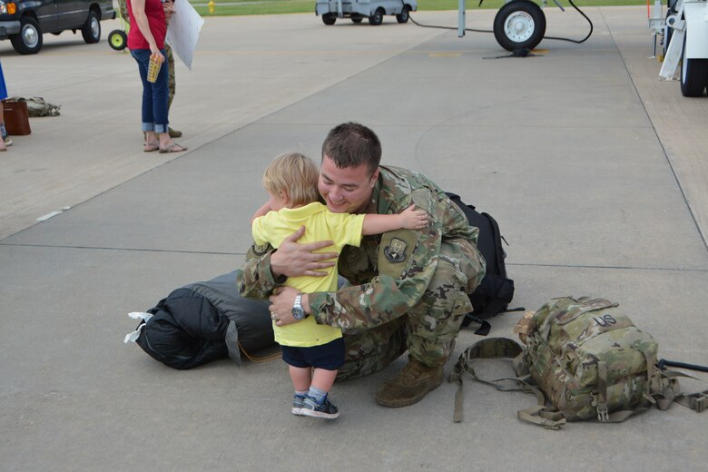 U.S. Air Force Senior Airman Morgan Conley with the 507th Aircraft Maintenance Squadron at Tinker Air Force Base, Okla., hugs his son following a deployment July 5, 2018. More than 100 Reserve Citizen Airmen from the 507th Air Refueling Wing at Tinker AFB deployed to Incirlik Air Base, Turkey, in support of air operations. (U.S. Air Force photo by Tech. Sgt. Samantha Mathison)