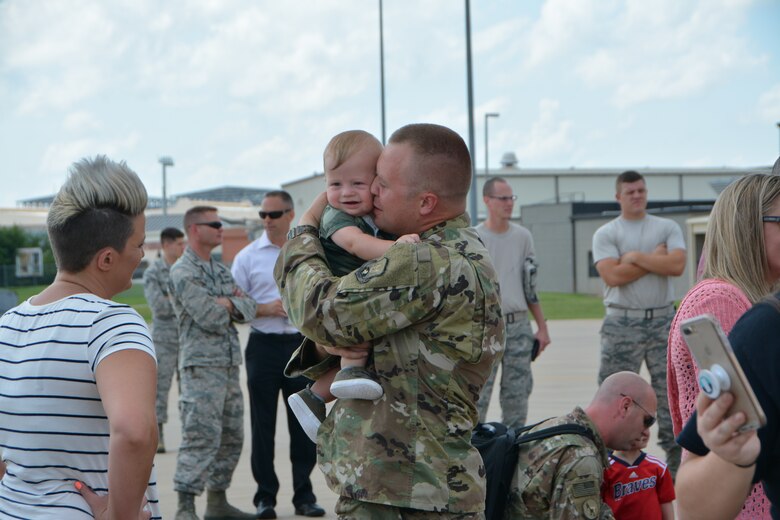 U.S. Air Force Master Sgt. Landon Rother, a KC-135R Stratotanker aircraft avionics technician with the 507th Aircraft Maintenance Squadron at Tinker Air Force Base, Okla., embraces his son following a deployment July 5, 2018. More than 100 Reserve Citizen Airmen from the 507th Air Refueling Wing at Tinker AFB deployed to Incirlik Air Base, Turkey, in support of air operations. (U.S. Air Force photo by Tech. Sgt. Samantha Mathison)