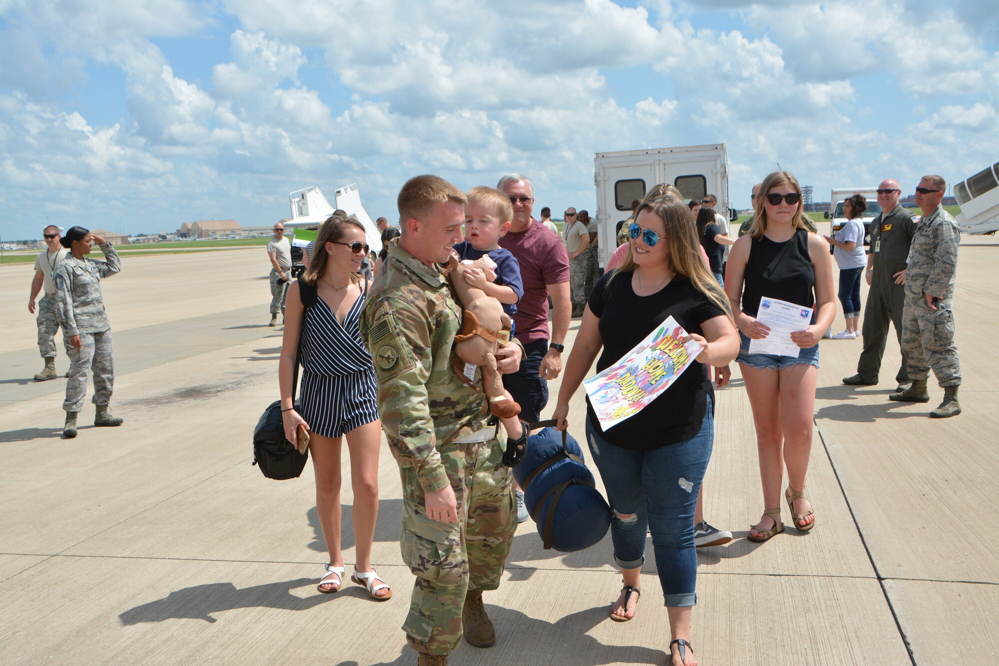U.S. Air Force Staff Sgt. Joshua Hines, a KC-135R Stratotanker aircraft crew chief with the 507th Aircraft Maintenance Squadron at Tinker Air Force Base, Okla., greets his family following a deployment July 5, 2018. More than 100 Reserve Citizen Airmen from the 507th Air Refueling Wing at Tinker AFB deployed to Incirlik Air Base, Turkey, in support of air operations. (U.S. Air Force photo by Tech. Sgt. Samantha Mathison)
