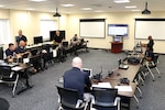 Members of the District of Columbia National Guard’s 33rd Civil Support Team and Delaware’s 31st CST, man the joint operations center on July 17, 2018, at the D.C. Armory in Washington, D.C. The JOC was the center for operations during the 33rd and 31st CSTs mobilization for the 2018 MLB All-Star Game at Nationals Park. (screens have been blurred)