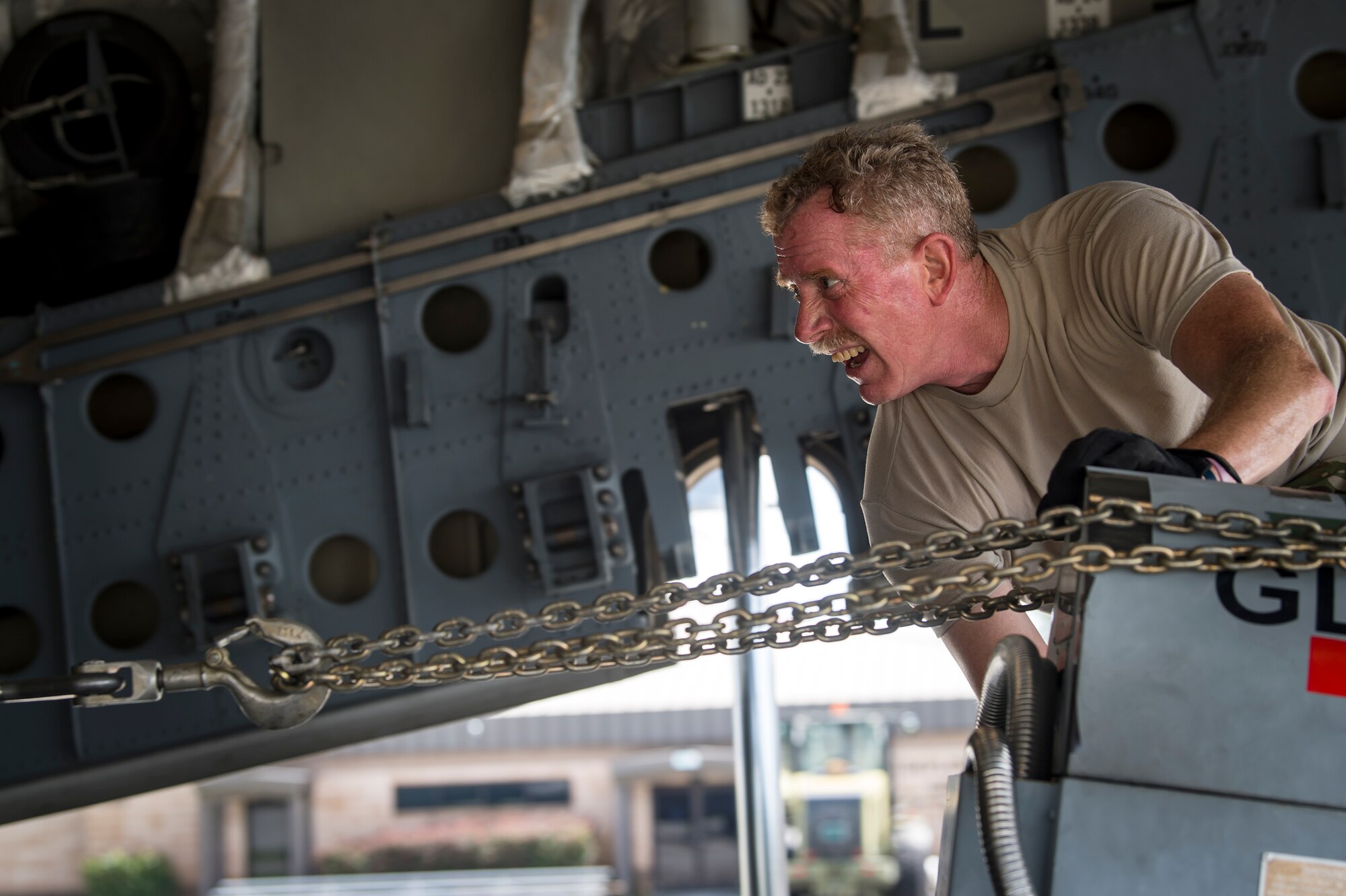 Master Sgt. Robert Kinsley, 155th Airlift Squadron loadmaster, Memphis Air National Guard Base, TN, pushes cargo up the ramp of a C-17 Globemaster III, July 5, 2018, at Moody Air Force Base, Ga. Airmen loaded approximately 68,000 pounds of cargo onto a C-17 Globemaster III to aid the 75th Fighter Squadron (FS) prior to a deployment. The 75th FS and supporting units recently deployed to an undisclosed location in support of Operation Spartan Shield. (U.S. Air Force photo by Airman 1st Class Eugene Oliver)