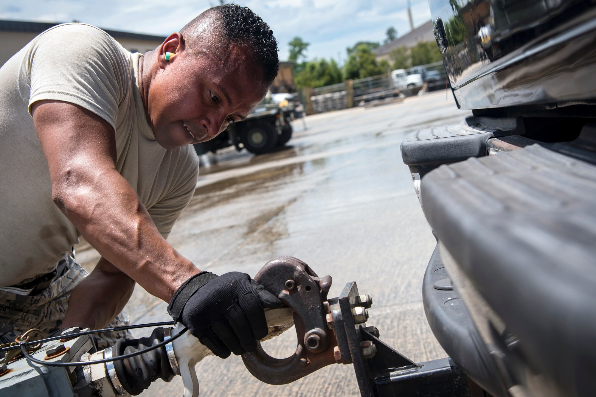 Staff Sgt. Mauricio Castaneda, 23d Logistics Readiness Squadron assistant NCO in charge of air terminal operations, latches a cargo shipment onto a truck, July 5, 2018, at Moody Air Force Base, Ga. Airmen loaded approximately 68,000 pounds of cargo onto a C-17 Globemaster III to aid the 75th Fighter Squadron (FS) prior to a deployment. The 75th FS and supporting units recently deployed to an undisclosed location in support of Operation Spartan Shield. (U.S. Air Force photo by Airman 1st Class Eugene Oliver)