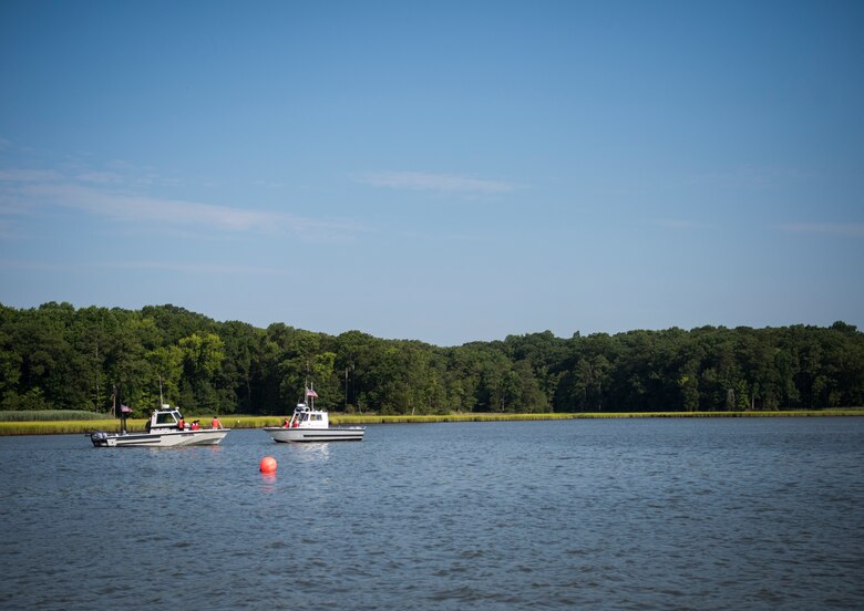 Volunteers wait for an aircraft crash exercise to begin at Joint Base Langley-Eustis, Virginia, July 17, 2018.