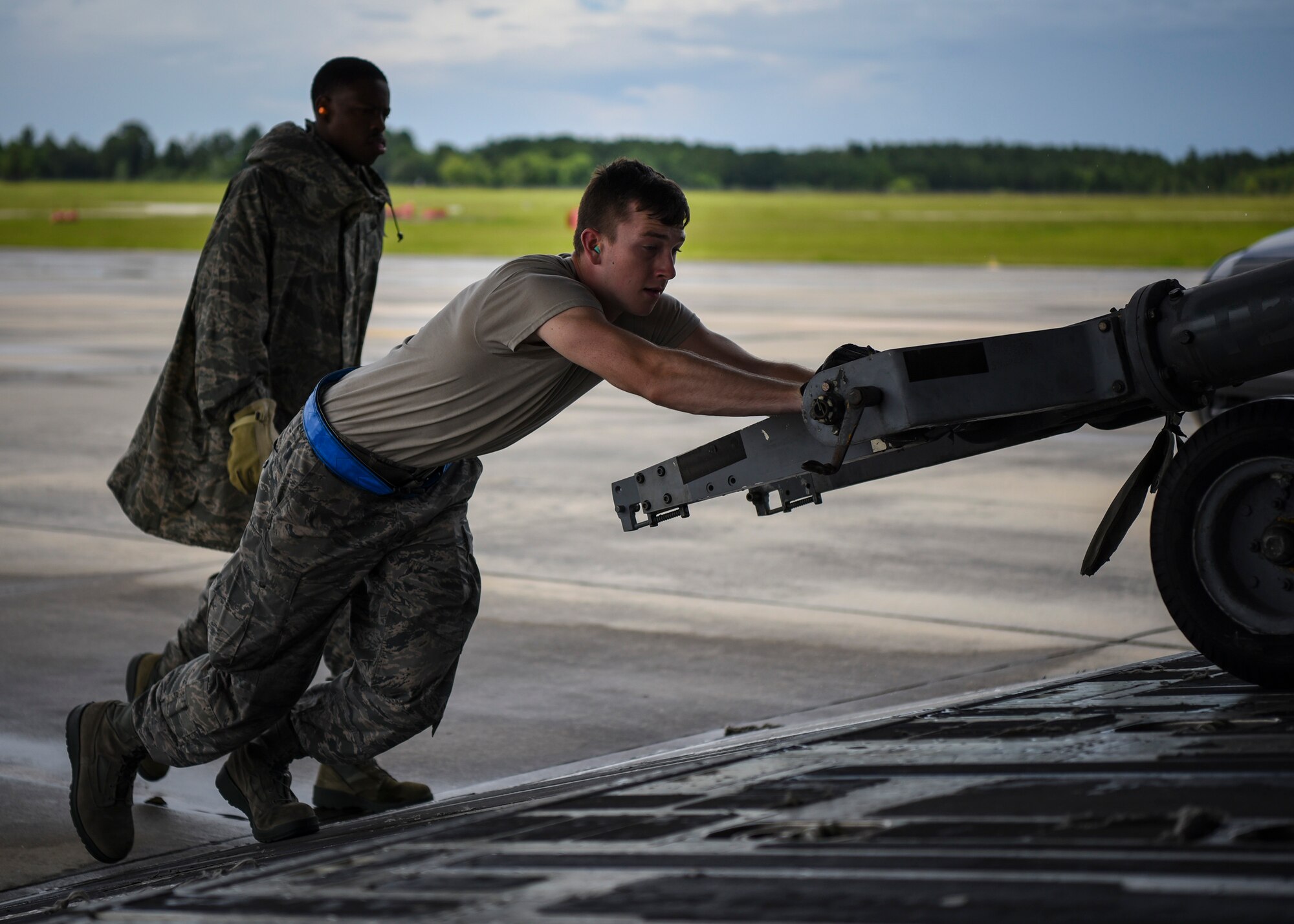 Airman 1st Class Alex White, 23d Logistics Readiness Squadron air terminal specialist, pushes a cart into a C-17 Globemaster III, July 5, 2018, at Moody Air Force Base, Ga.  Airmen loaded approximately 68,000 pounds of cargo onto a C-17 to aid the 75th Fighter Squadron (FS) prior to a deployment. The 75th FS and supporting units recently deployed to an undisclosed location in support of Operation Spartan Shield. (U.S. Air Force photo by Airman Taryn Butler)