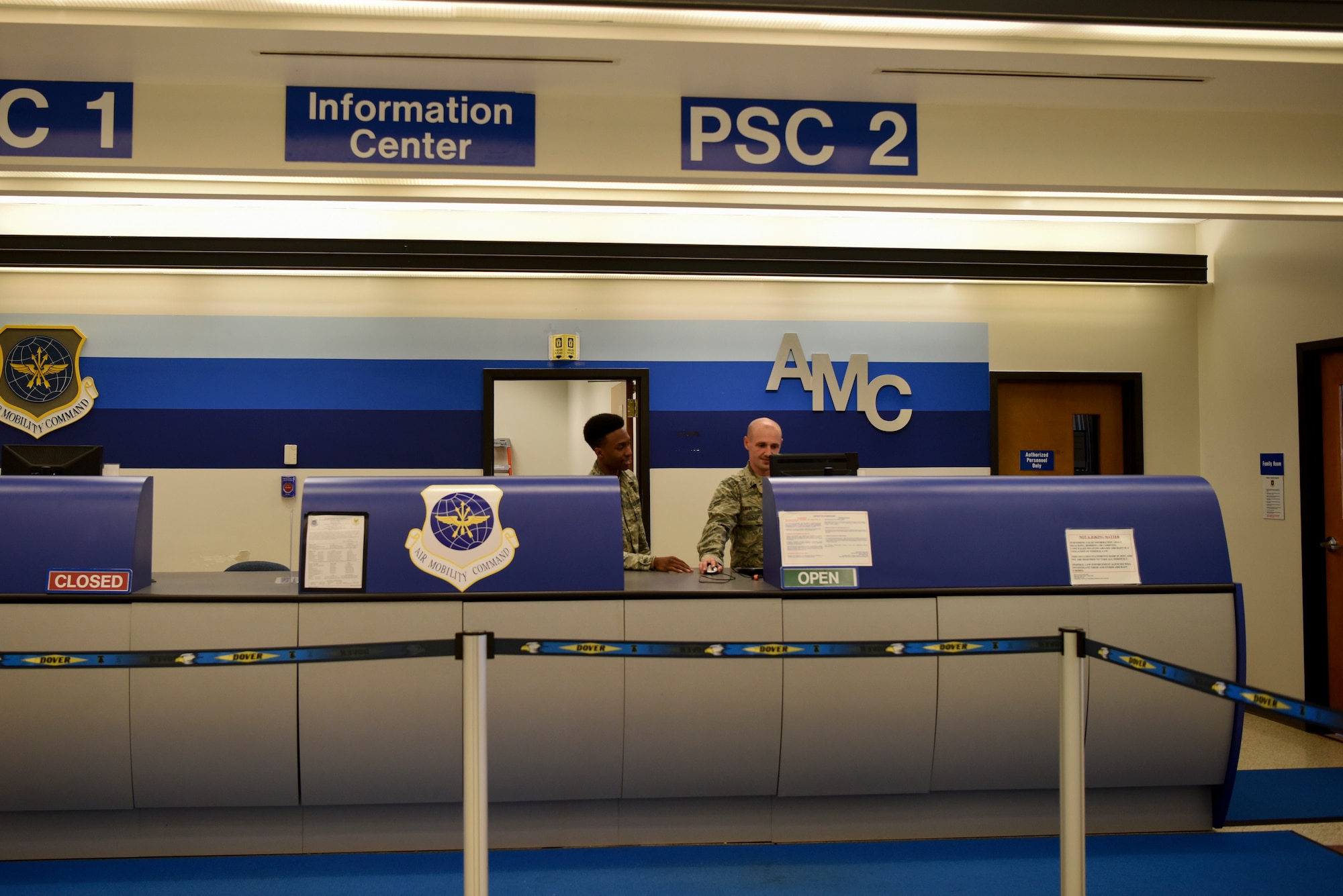 Airman 1st Class Vincent Prysock, 436th Aerial Port Squadron passenger service agent, and Airman 1st Class Artem Savin, 88th APS air transportation specialist, work at the information center July 16, 2018, at the 436th Passenger Terminal at Dover Air Force Base. The passenger terminal is responsible for the movement of passengers, including service members, retirees and dependents. (U.S. Air Force photo by Airman 1st Class Zoe M. Wockenfuss)