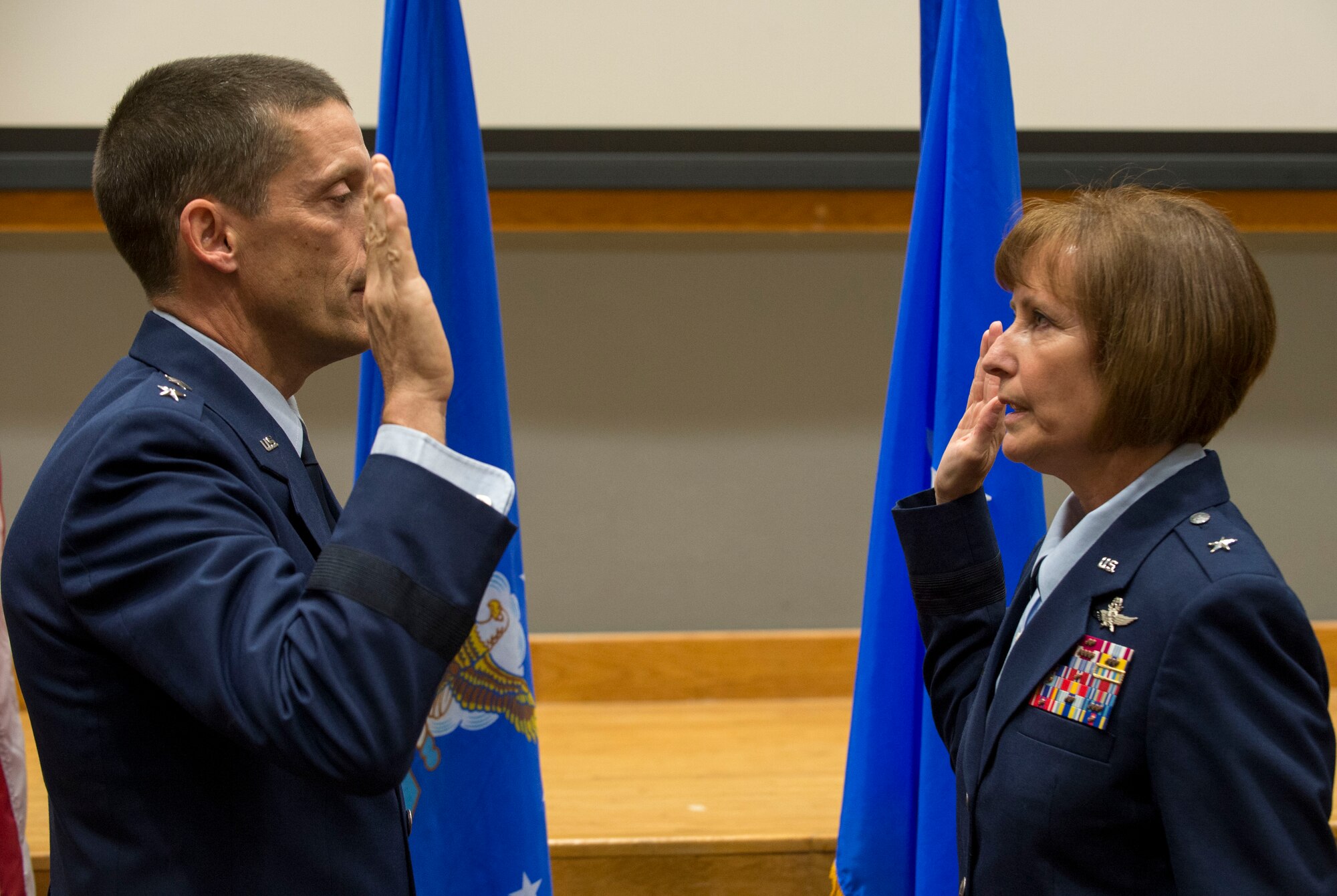 Maj. Gen. Robert Skinner, Air Forces Cyber commander, administers the Oath of Office to Brig. Gen. Michelle Hayworth, AFCYBER vice commander, during her promotion ceremony at Joint Base San Antonio-Lackland, Texas, July, 16, 2018. In June, Hayworth re-joined AFCYBER from Air Force Space Command. She previously served in AFCYBER, most recently as the 688th Cyberspace Wing Commander. (U.S. Air Force photo by Tech. Sgt. R.J. Biermann)