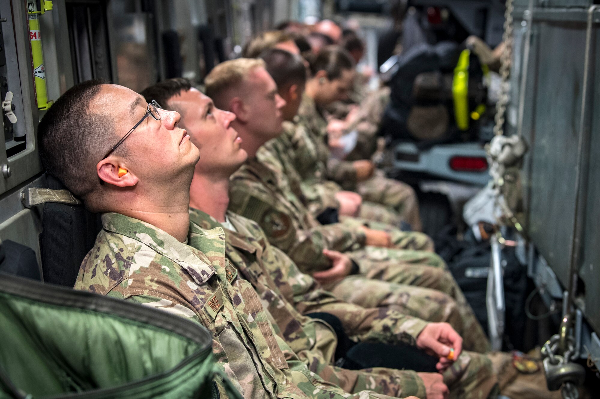 Moody Airmen wait inside a C-17 Globemaster III prior to deploying, July 5, 2018, at Moody Air Force Base, Ga. Airmen from the 75th Fighter Squadron (FS) and supporting units recently deployed to an undisclosed location in support of Operation Spartan Shield. The 75th FS will undertake close air support missions with the A-10C Thunderbolt II while deployed. (U.S. Air Force photo by Airman 1st Class Eugene Oliver)