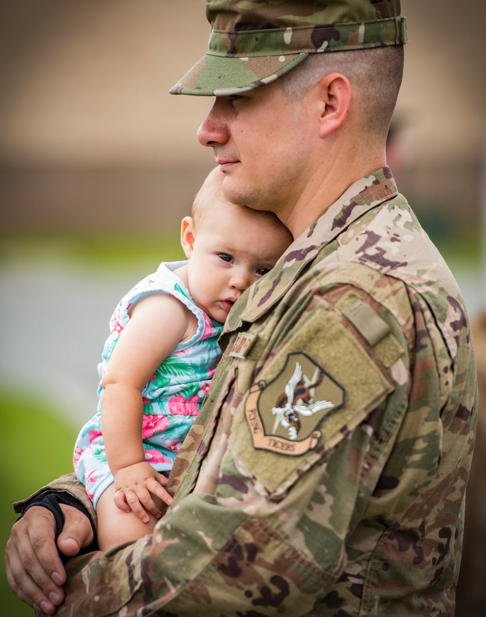 Tech. Sgt. Christopher West, 23d Aircraft Maintenance Squadron weapons expeditor, holds his daughter, Savannah, July 9, 2018, at Moody Air Force Base, Ga. Airmen from the 75th Fighter Squadron (FS) and supporting units deployed to an undisclosed location in support of Operation Spartan Shield. (U.S. Air Force photo by Staff Sgt. Ceaira Tinsley)