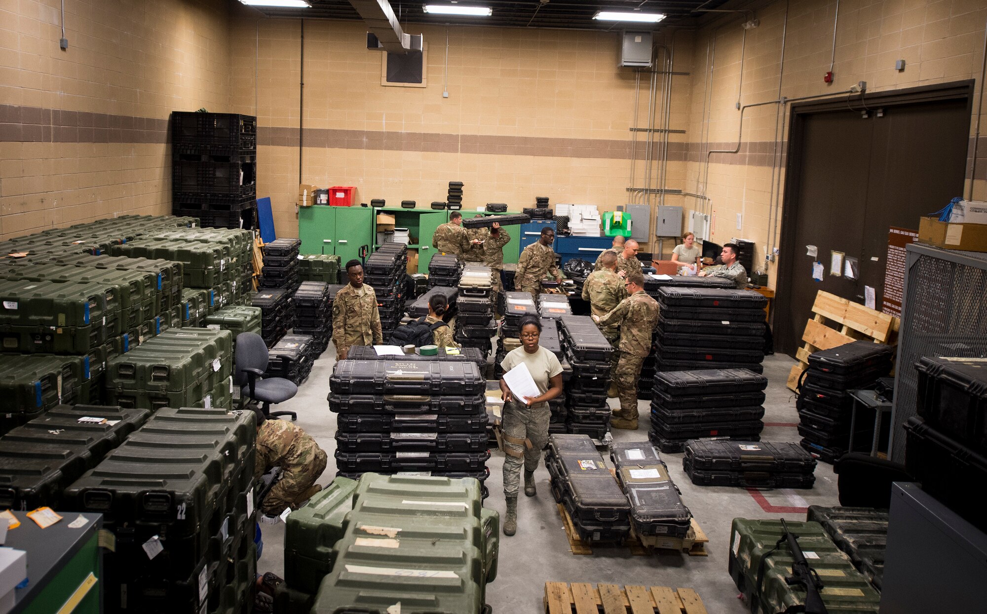 Airmen from the 75th Fighter Squadron (FS) and supporting units gather gear July 8, 2018, at Moody Air Force Base, Ga. The 75th FS and supporting units deployed to an undisclosed location in support of Operation Spartan Shield. (U.S. Air Force photo by Staff Sgt. Ceaira Tinsley)