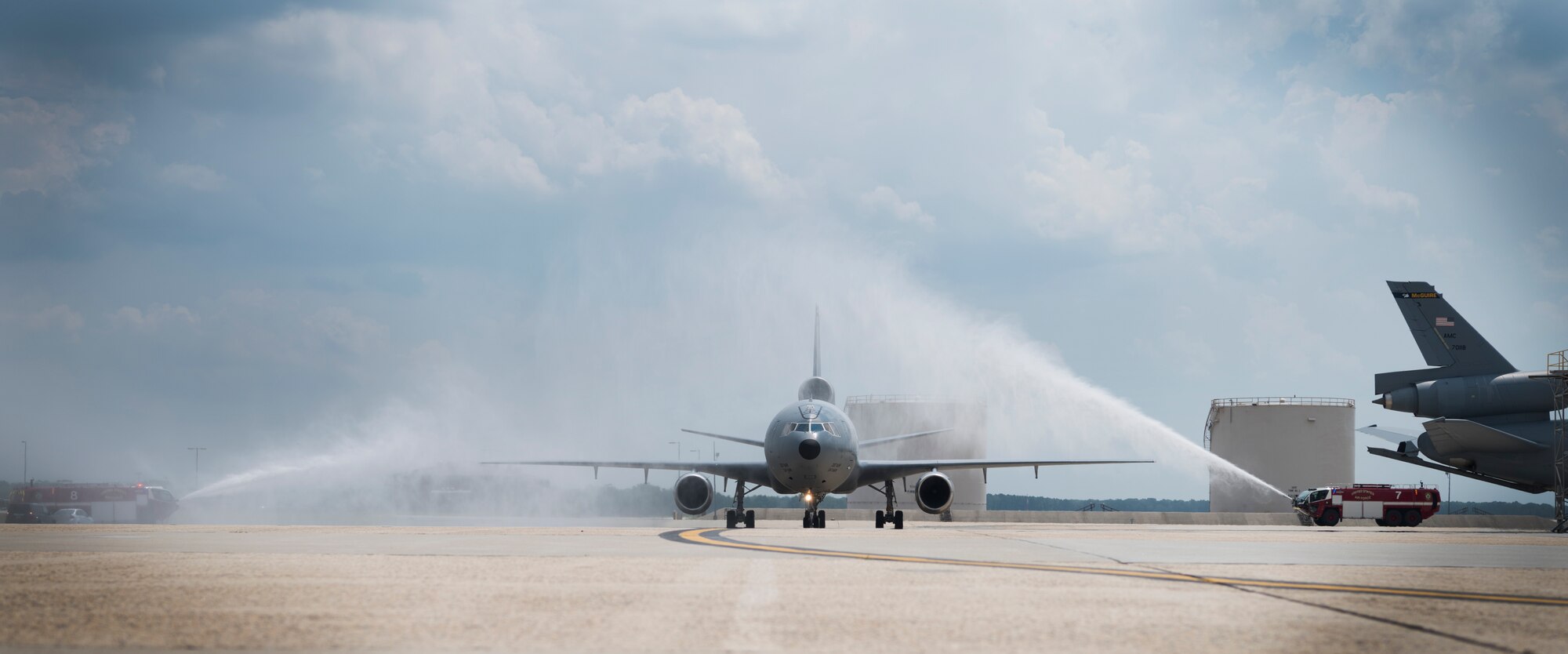 A U.S. Air Force KC-10 Extender piloted by Air Force Col. Darren Cole, 305th Air Mobility Wing commander, taxis on the flightline underneath a water arch during his fini flight on Joint Base McGuire-Dix-Lakehurst, N.J., July 17, 2018. Cole performed his final flight on Joint Base MDL before traveling to his next assignment at Joint Base Andrews as the director of U.S. Central Command Deployment and Distribution Operations Center and deputy director of USCENTCOM Logistics and Engineering Directorate. (U.S. Air Force photo by Airman Ariel Owings)